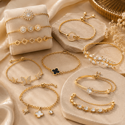"Elegant artificial gold bracelet collection featuring crystal, butterfly, floral, heart, and charm designs displayed on a luxurious beige background."